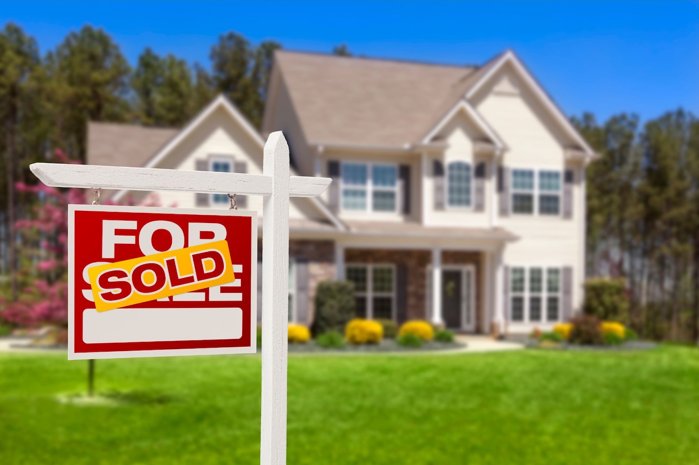 Home with a sold sign