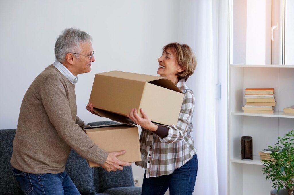 Mature married couple decluttering their home
